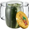 Three glass jars, one filled with pickles and another with a lid featuring a Winnie the Pooh illustration. Produktbild-Vorschau