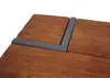 A close-up view of a wooden surface with a metal corner brace. Voir les images du produit