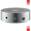 A silver cylindrical speaker with controls on top and ports on the side, set against a white background. Náhľad obrázku produktu