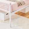 Close-up of a white metal bed frame with a pink mattress and a beige blanket, showing measurements. Produktbild-Vorschau