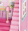 A close-up view of a pink dollhouse interior, showing stairs, a lamp, and a window. Náhľad obrázku produktu