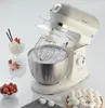 A vintage-style kitchen mixer with a whisk attachment in a bowl of meringue, surrounded by strawberries and meringues. Náhled obrázku produktu