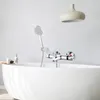 A modern bathroom with a white bathtub and a chrome faucet with a showerhead. Produktbild-Vorschau