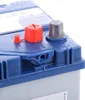 A close-up view of the top of a car battery. Produktbild-Vorschau