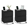 Two black bedside tables with charging stations on top. Produktbild-Vorschau