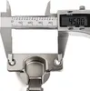 A digital caliper is measuring a cabinet hinge. Produktbild-Vorschau
