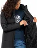 A woman is shown wearing a black jacket and putting her hand into an inner pocket. Produktbild-Vorschau