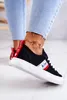 A close-up shot of a person wearing black Lee Cooper sneakers. Náhľad obrázku produktu