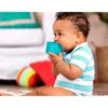 A baby is playing with soft number blocks on the floor. Podgląd zdjęcia produktu