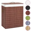 A brown bamboo laundry basket with a white lid and handles, shown on a white background. Several circular swatches of different colors and patterns are displayed to the right of the basket. Náhľad obrázku produktu