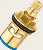 A close-up studio shot of a brass faucet valve cartridge. Produktbild-Vorschau