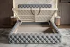 A tufted upholstered bed frame with its storage lift mechanism open, revealing the storage space and wooden slats. Náhľad obrázku produktu