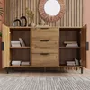 A wooden sideboard with drawers and doors is shown open, displaying books and decorative items. The sideboard is set against a wooden paneled wall with a decorative mirror above it. Anteprima dell’immagine prodotto