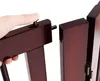 A hand is shown pushing a pin into a wooden gate to connect it to another section. Produktbild-Vorschau