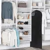 An organized closet with clothes and accessories neatly displayed on shelves and hanging. Produktbild-Vorschau