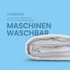 A folded white duvet is shown against a light blue background with text and laundry symbols. Podgląd zdjęcia produktu