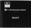 A close-up view of a black electronic device with text and a button. Produktbild-Vorschau
