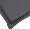 A close-up view of the corner of a dark gray cushion or mattress topper, showing the stitching and fabric texture. Voir les images du produit