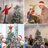 Collage of images showing families and individuals decorating Christmas trees with tree toppers. Produktbild-Vorschau