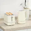 A toaster and a kettle are placed on a kitchen countertop. Produktbild-Vorschau
