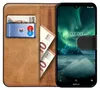 A flip case for a smartphone, showing cards and money inside. Náhľad obrázku produktu