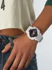A person wearing a white G-Shock watch on their wrist. Produktbild-Vorschau