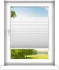 A white pleated blind is shown covering the middle section of a window, with a view of trees and a landscape visible above and below the blind. Produktbild-Vorschau