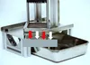 A vertical potato chip slicer with a collection tray. Náhled obrázku produktu