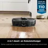 A robot vacuum cleaner is cleaning a wooden floor, with debris scattered on the floor. Produktbild-Vorschau