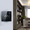 A smart thermostat is mounted on a wall next to a bookshelf in a modern room. Produktbild-Vorschau
