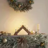 A Christmas-themed mantelpiece decorated with a wreath, garland, ornaments, and a candle bridge. Voir les images du produit