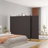 A bedroom scene with a bed, nightstand, and a room divider. Náhľad obrázku produktu
