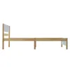 A side view of a wooden bed frame with a white headboard. Produktbild-Vorschau