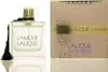 A bottle of Lalique L'Amour eau de Parfum and its packaging are displayed on a reflective white surface. Voir les images du produit