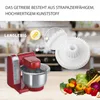 A red kitchen mixer with a stainless steel bowl, a close-up of a white gear, and a pile of fresh vegetables. Produktbild-Vorschau