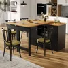 A modern kitchen island with chairs and place settings. Produktbild-Vorschau