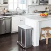A modern kitchen scene featuring a stainless steel trash can, dishwasher, sink, and kitchen island. Podgląd zdjęcia produktu