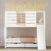 A children's bunk bed designed to look like a house, complete with a slide and storage drawers. Anteprima dell’immagine prodotto