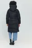 A woman is shown from behind wearing a black puffer coat and blue jeans. Produktbild-Vorschau