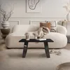 A modern living room with a sofa, coffee table, and rug. Náhľad obrázku produktu