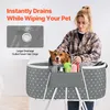 A woman is drying a dog in a portable pet bath tub. Produktbild-Vorschau