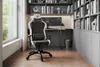 A gaming chair in a home office setting with bookshelves and a window. Náhľad obrázku produktu