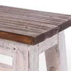 A close-up view of the corner of a wooden stool. Produktbild-Vorschau
