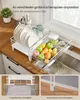 A dish drying rack is shown on a kitchen counter next to a sink. The image also includes close-up shots of the dish rack's features. Produktbild-Vorschau
