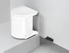 A white trash can with a lid is mounted inside a cabinet. Produktbild-Vorschau