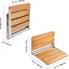 Two views of a wooden folding shower seat with dimensions indicated by measurement lines and text. Anteprima dell’immagine prodotto