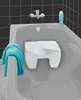 A white bath stool is placed inside a bathtub, with a blue towel draped over the side. Podgląd zdjęcia produktu
