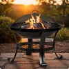 A fire pit with burning logs in a backyard setting during sunset. Anteprima dell’immagine prodotto