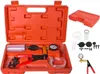 A vacuum pump kit is displayed in an open orange case, with accessories laid out separately. Náhľad obrázku produktu