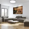 A modern living room with a sectional sofa, coffee table, and abstract art on the wall. Podgląd zdjęcia produktu